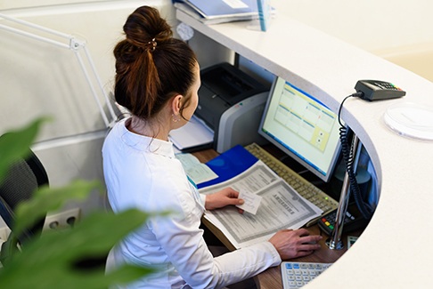 Receptionist at a desk