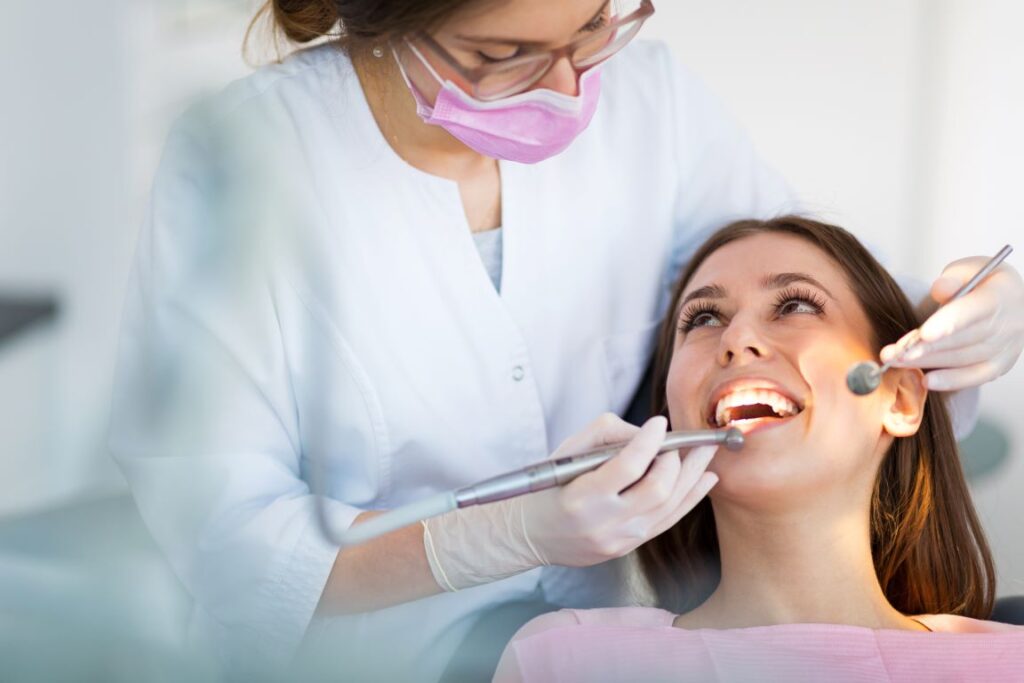 A woman undergoing a dental exam before cosmetic dentistry.